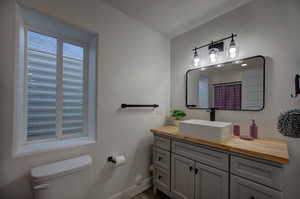 Bathroom with toilet and vanity