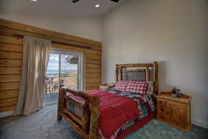 Bedroom with vaulted ceiling, access to outside, carpet flooring, and recessed lighting