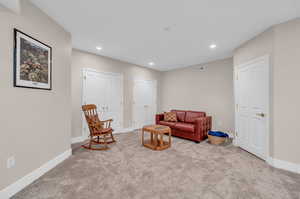 Living area with carpet floors