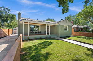 View of front of property featuring a front yard