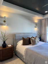 Carpeted bedroom featuring a textured ceiling