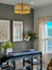 Dining room with hardwood / wood-style floors, a textured ceiling, and a wealth of natural light