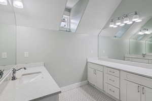 Bathroom featuring vanity and tile patterned flooring