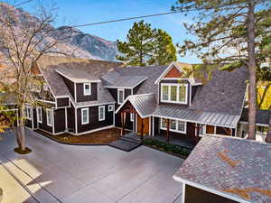 View of front of home with a mountain view and covered porch