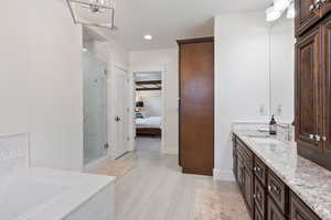 Bathroom with vanity and independent shower and bath