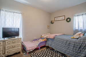 View of carpeted bedroom with walk-in closet