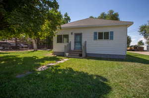 Bungalow-style house featuring a front yard