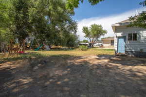 View of yard featuring a playground