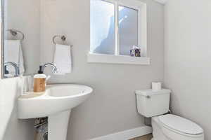 Bathroom featuring toilet and tile patterned floors