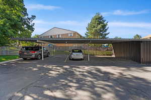 View of parking with a carport