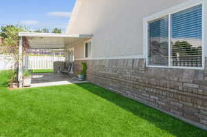 View of yard with a patio area