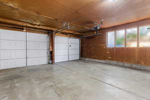 Garage featuring a garage door opener