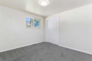 Unfurnished room featuring carpet floors