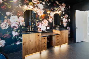 Bathroom with double vanity and tile patterned floors