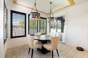 Dining area with a raised ceiling