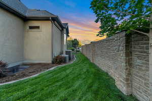 Yard at dusk with cooling unit