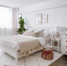 Bedroom with wood-type flooring and a textured ceiling