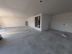 Interior space featuring concrete floors and heating unit