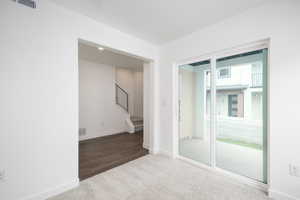 Spare room featuring wood-type flooring