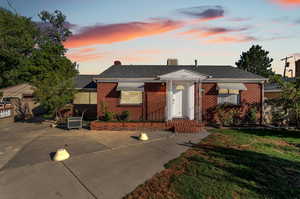 View of front of property featuring a lawn