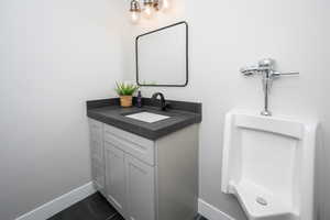 Bathroom featuring tile patterned floors and vanity