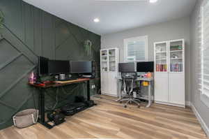 Office area with light wood-type flooring