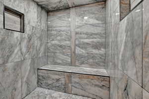 Bathroom featuring a tile shower