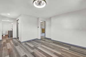 Empty room featuring sink and hardwood / wood-style flooring