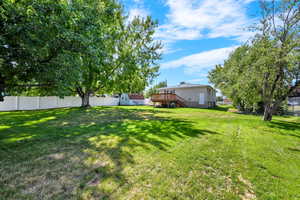 View of yard featuring a wooden deck