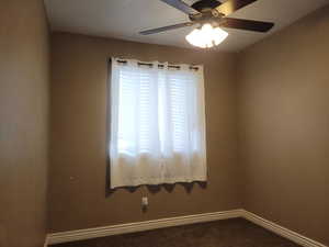 Unfurnished room with carpet flooring and ceiling fan