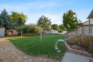 View of yard with a wooden deck