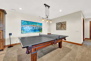 Playroom with light hardwood / wood-style floors