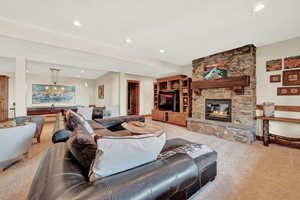 Living room with light carpet and a fireplace