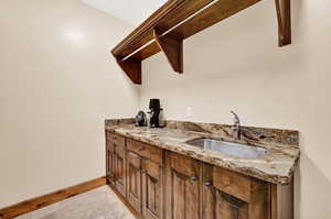 Interior space featuring sink and tile patterned floors