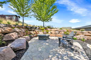 View of patio featuring an outdoor fire pit