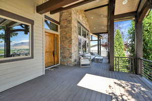 Wooden terrace featuring a mountain view