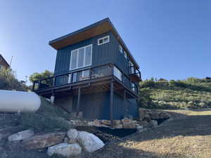 Rear view of house with a wooden deck