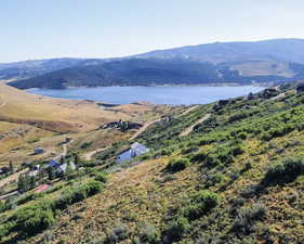 Property view of mountains featuring a water view