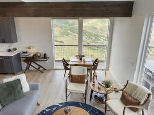 Dining space featuring light wood-type flooring and a wealth of natural light