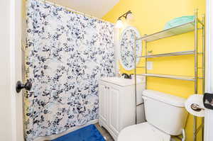 Bathroom with toilet and vanity