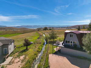 Aerial view featuring a rural view and a mountain view