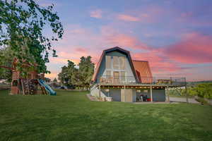 Exterior space with a playground and a patio