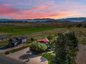 Aerial view at dusk with a rural view and a mountain view