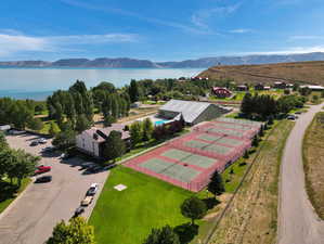 Drone / aerial view featuring a water and mountain view