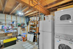 Clothes washing area with stacked washer and clothes dryer