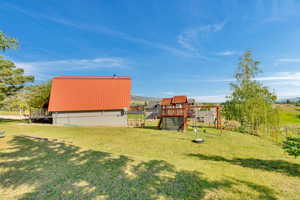 View of yard featuring a playground