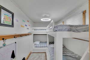 Bedroom featuring wood-type flooring