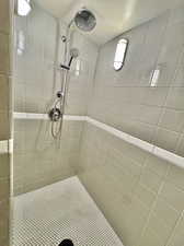 Bathroom featuring tiled shower