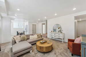 Living room with light colored carpet