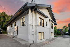 View of property exterior at dusk